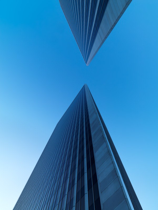 A view looking upward between Century Plaza's twin towers
